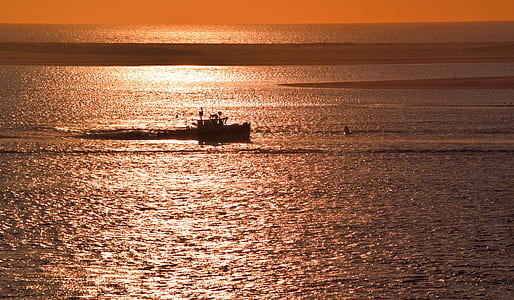 person riding boat on body of water thumbnail