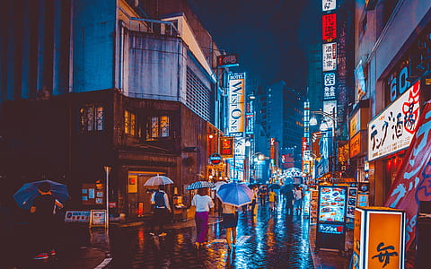 people in the city walking at night time thumbnail