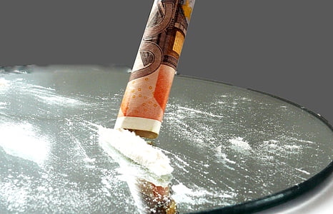 closeup photography of rolled banknote with cocaine thumbnail
