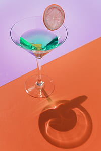 clear cocktail glass on table thumbnail