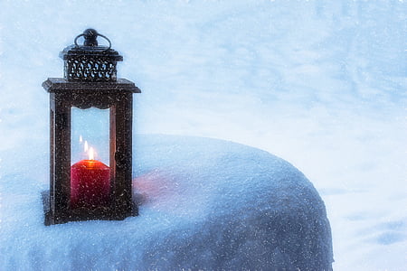 black candle lantern on white surface thumbnail