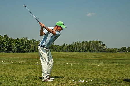 man playing golf during daytime thumbnail