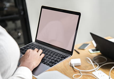 person using silver MacBook on focus photo thumbnail
