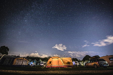 photo of camping tent on parking area during nighttime thumbnail