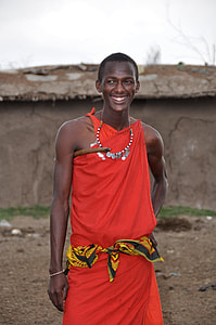smiling man wearing orange dress thumbnail