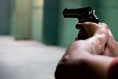 person holding silver gun thumbnail