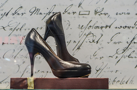 shallow focus photography of pair of black platform stilettos thumbnail