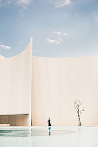 woman standing beside swimming pool at daytime thumbnail