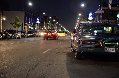 gray muscle car parked along side the road thumbnail