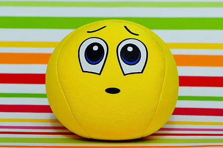 yellow ball on white and multicolored striped textile thumbnail