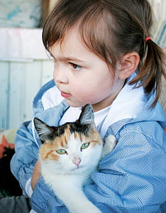 girl holding cat standing thumbnail
