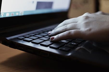 turned-on black laptop computer thumbnail