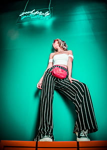 woman standing near to wall thumbnail