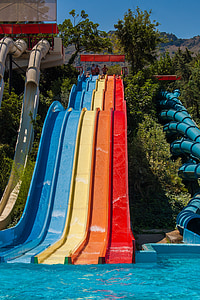 blue, yellow, and red slides during daytime thumbnail