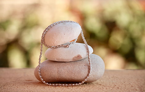 shallow focus photo of beaded gold-colored necklace thumbnail
