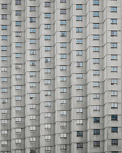 concrete building with glass windows during day thumbnail