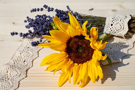 yellow sunflower on beige wooden surface thumbnail