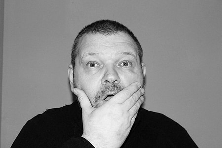 man covering his mouth thumbnail