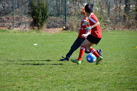 two boy playing soccker thumbnail