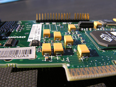 green and yellow expansion card on black surface thumbnail