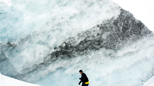 person standing on snowy mountain during daytime thumbnail