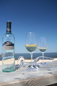 wine glasses on table under sunny sky thumbnail