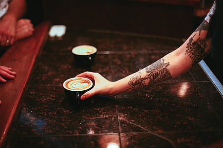 person holding black ceramic cup thumbnail