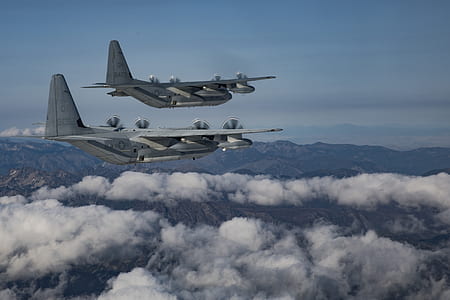 two gray B-52 bomber flying on the white clouds sky thumbnail