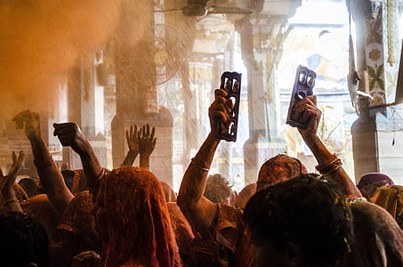 group of people covered with orange powder thumbnail