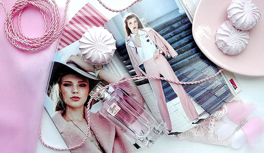 perfume bottle with woman's photo beside pink plate thumbnail