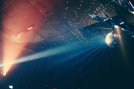 Shining disco ball in a discotheque over a smokey dance floor thumbnail