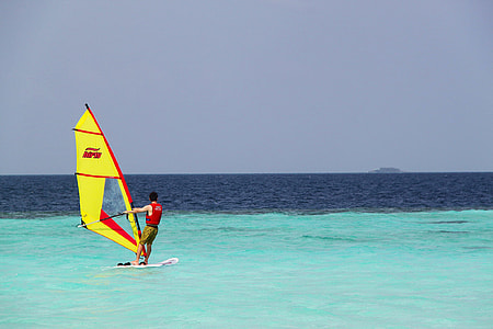 person parasailing in middle of ocean thumbnail