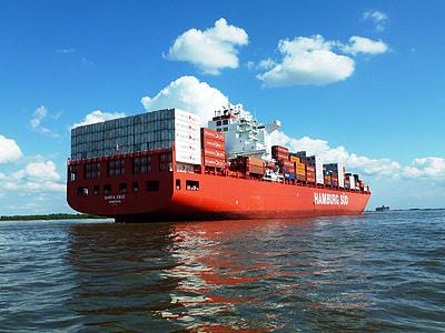 red cargo ship on body of water thumbnail