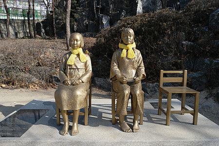 two gold women sitting on chair statue thumbnail