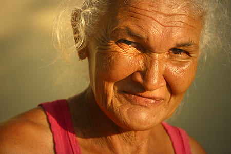 Woman In Red Tank Top Smiling thumbnail