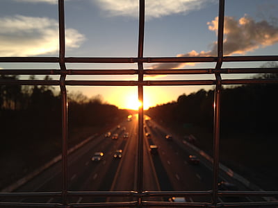 cars on street road during sunset thumbnail