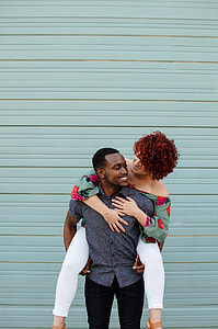 man carrying a woman on back thumbnail