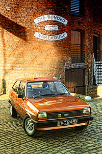 orange Ford sedan thumbnail