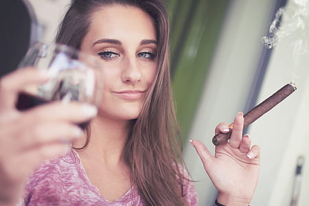 Young girl with a cigar and a glass of alcohol thumbnail