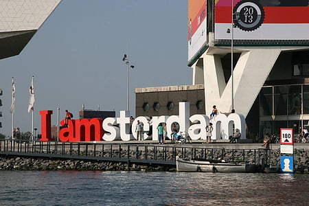 white and red I Amsterdam freestanding letters landmark near body of water during daytime thumbnail