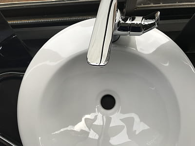 White Ceramic Sink With Stainless Steel Faucet thumbnail
