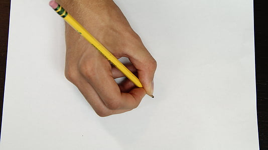 person holding yellow pencil on white paper thumbnail