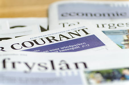 closeup photo of newspapers thumbnail