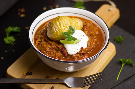 brown soup filled white bowl thumbnail