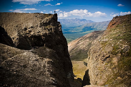 person standing near cliff thumbnail