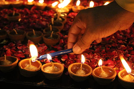 person lighting candles thumbnail