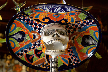 white and black skull and black, and green floral hat figurine thumbnail