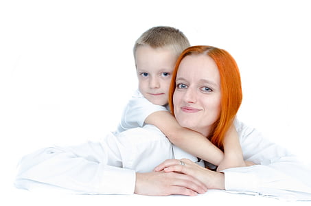 smiling woman with boy at her back thumbnail