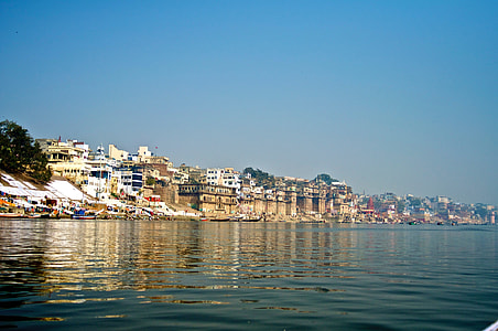 white and brown houses beside body of water thumbnail