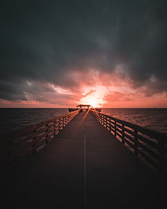 brown bridge on ocean thumbnail